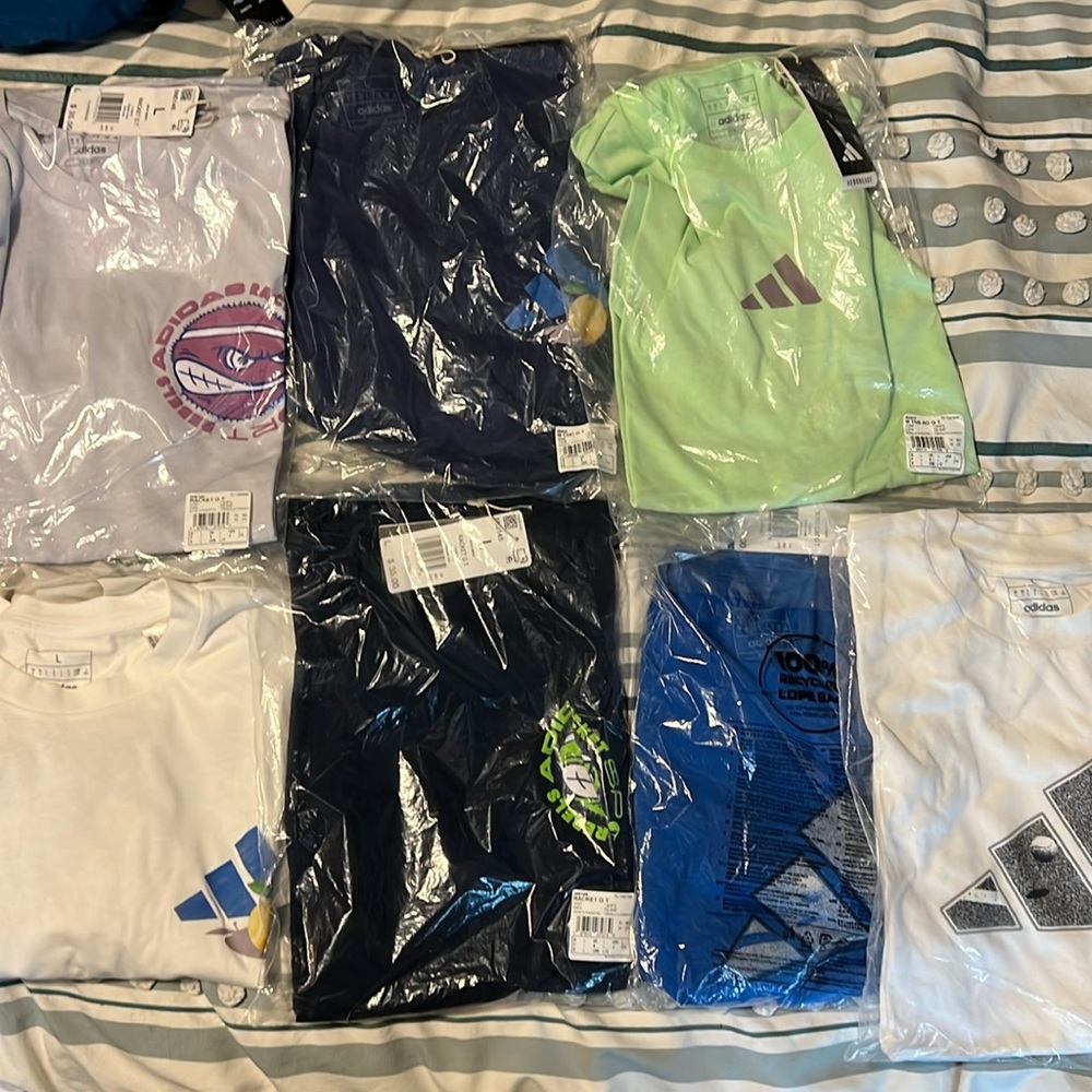 NWT lots of seven men’s adidas t-shirts.
